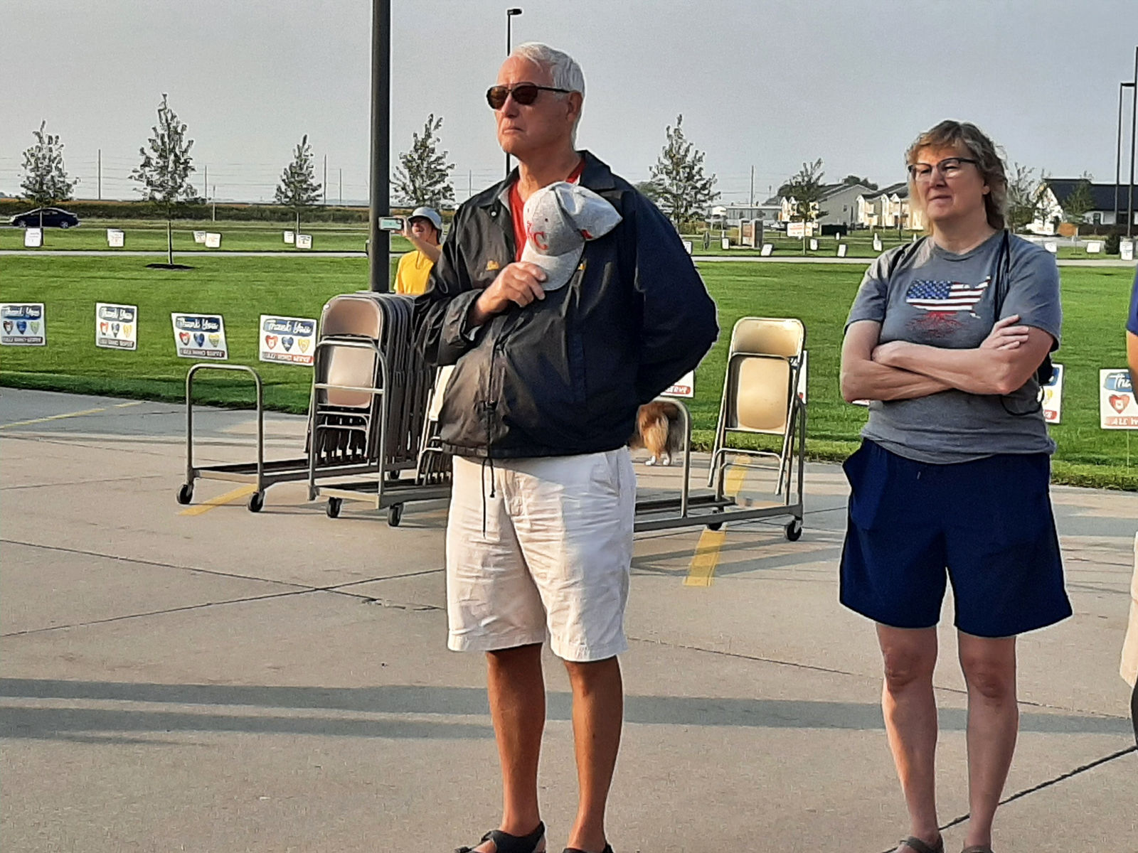Man and woman listen during event